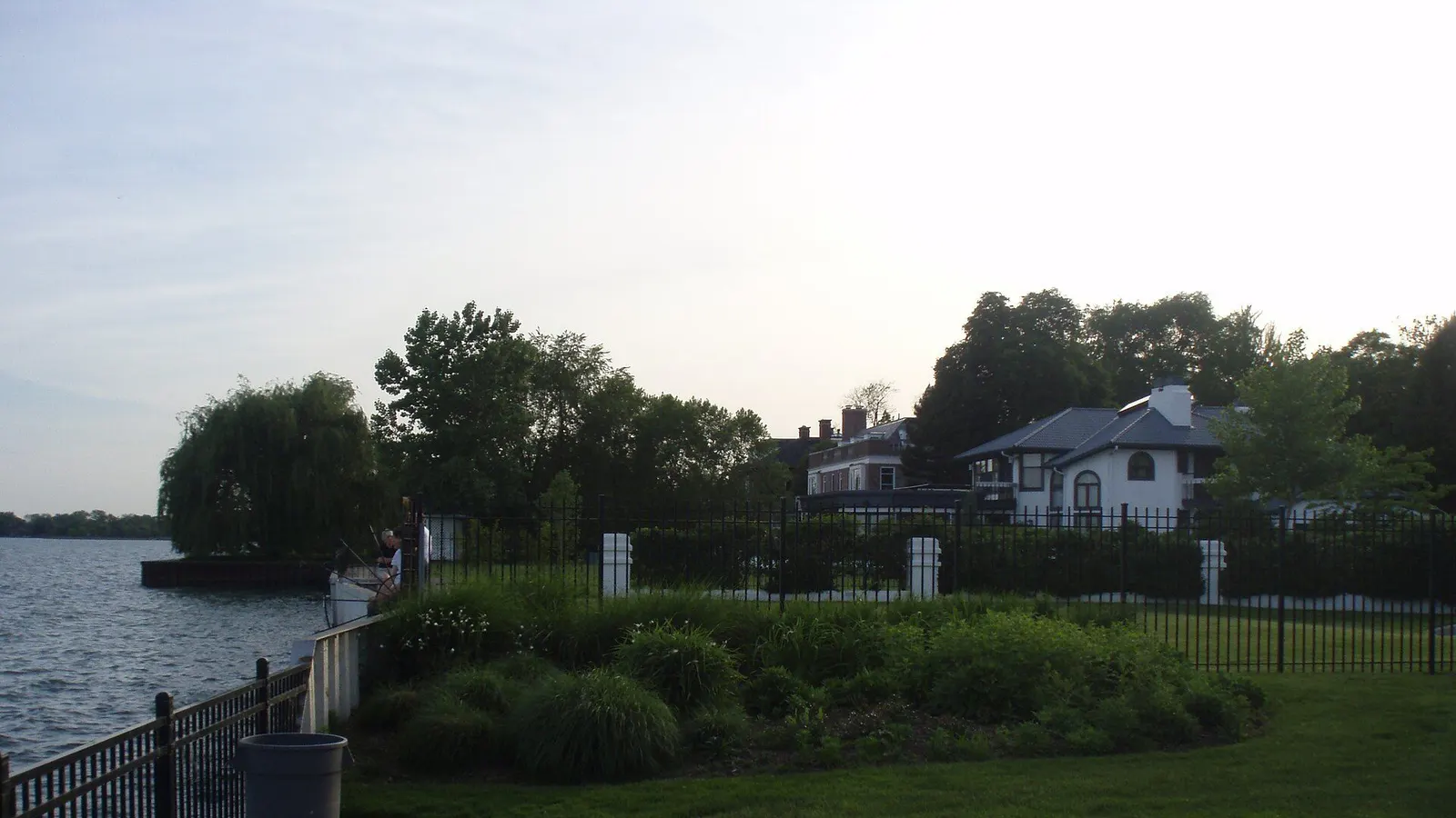 Tree-lined residential street with historic homes near Lake St. Clair in Grosse Pointe, MI