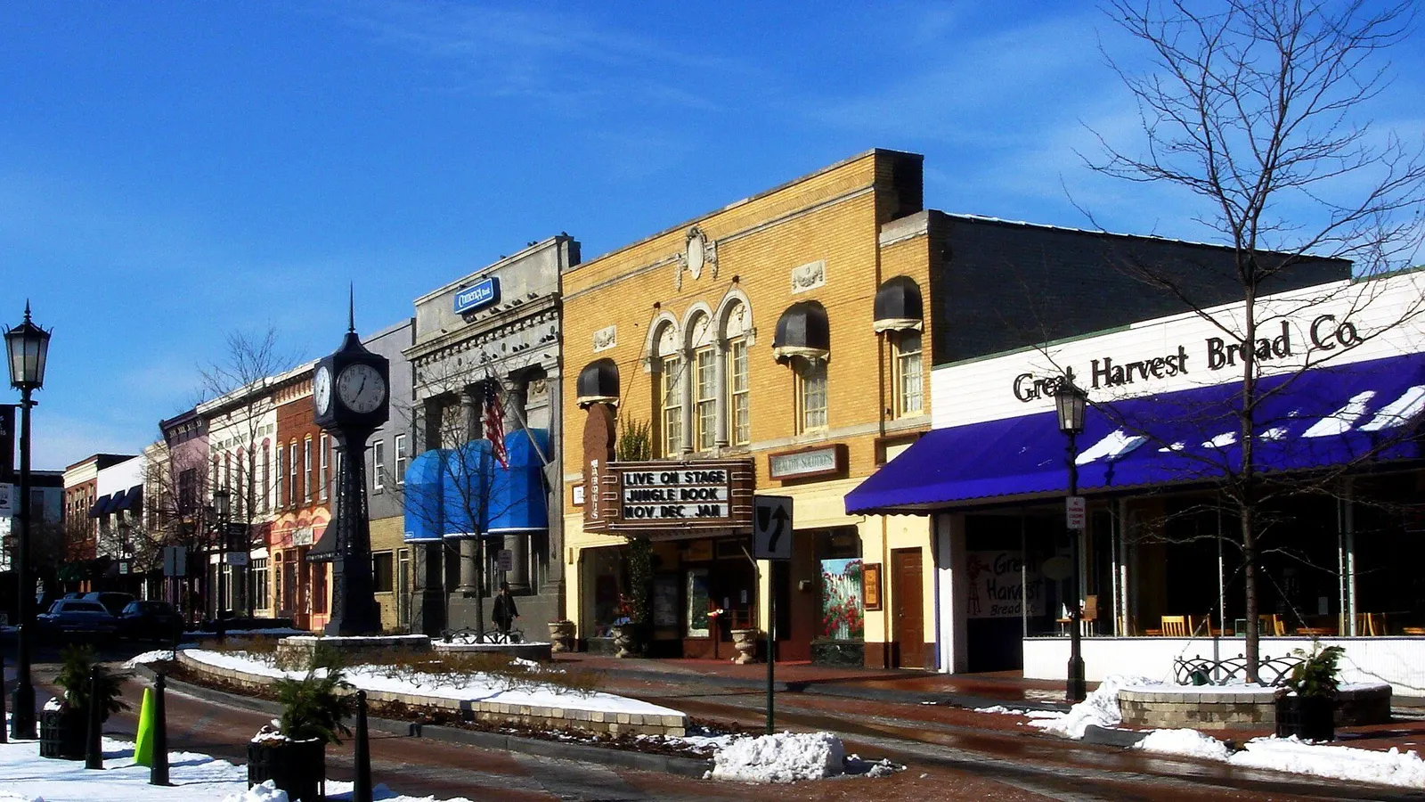Historic downtown Northville, Michigan, with restored Victorian storefronts and tree-lined Main Street