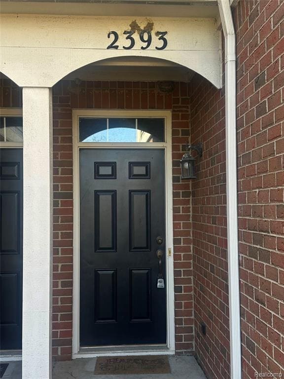 Front door entry with sidelight and arched transom