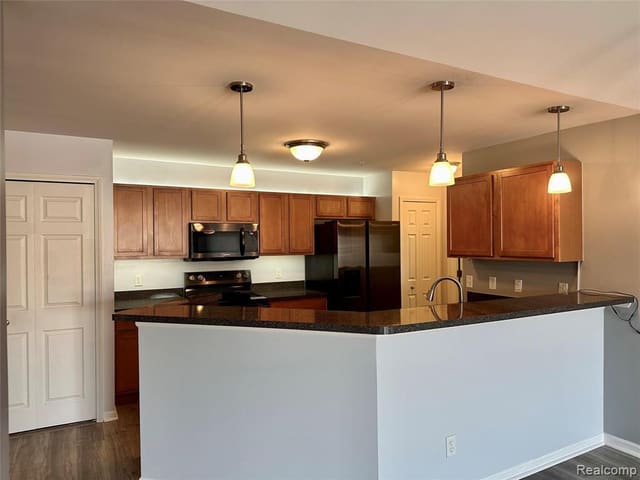 Open kitchen and dining area under a vaulted ceiling