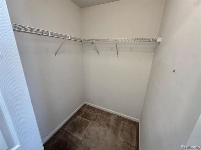 His-and-hers walk-in closet shelving in the primary suite
