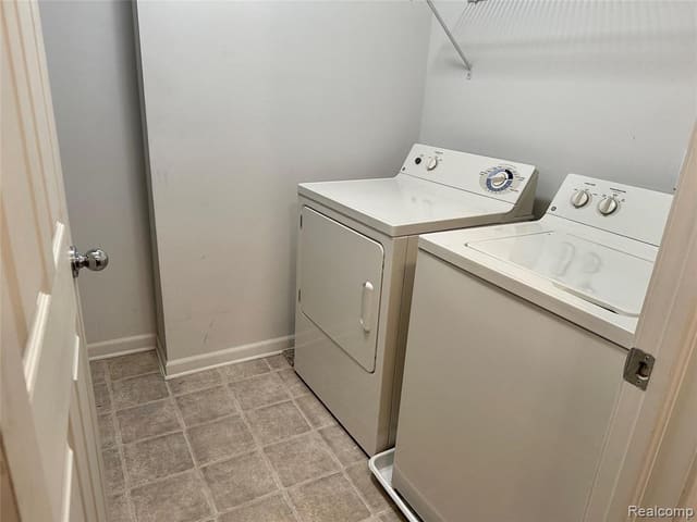 In-unit laundry area with washer and dryer