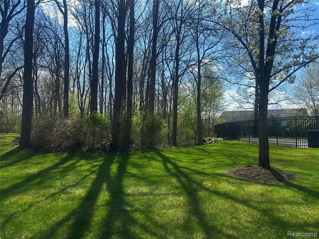 Manicured community grounds among mature trees