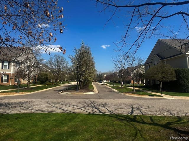 Community pathway lined with mature trees